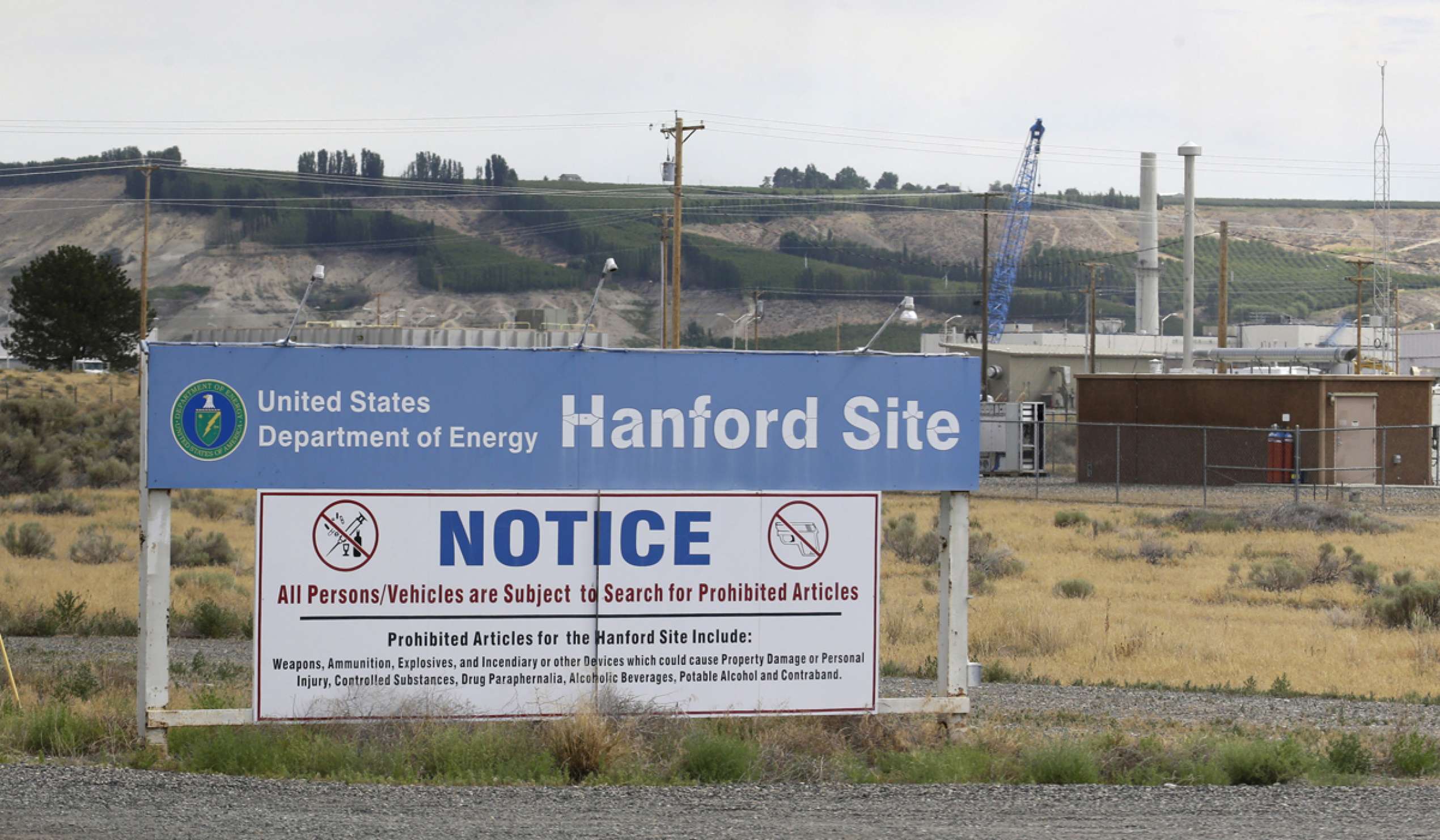A sign informs visitors of prohibited items on the Hanford Nuclear Reservation near Richland, Washington in July 2014. from Ted S. Warren/AP