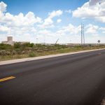 A 13 mile strip of the WIPP north access road was resurfaced as a part of the settlement