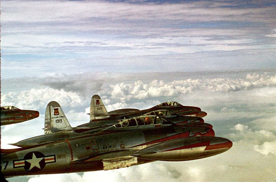 Republic F-84G Thunderjets of the 55th Fighter Bomber Squadron cruise over the Atlantic Ocean enroute to England in 1952. In a few months, the 20th Fighter Bomber Wing had developed tactics for a nuclear strike mission, the first USAF fighter unit to pick up a nuclear role.