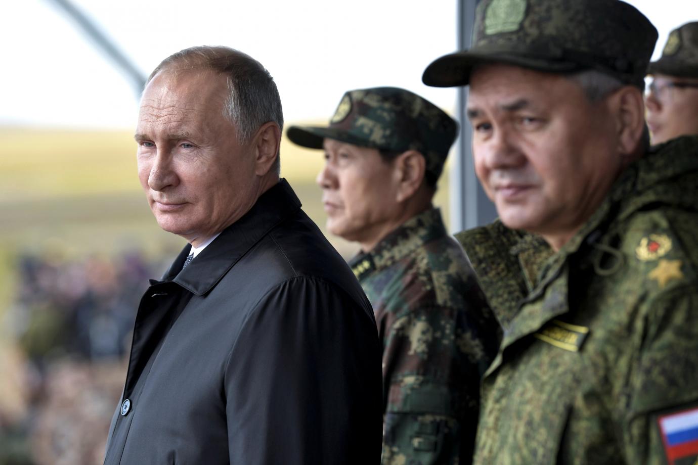 The Return of Doomsday: Vladimir Putin and his Defense Minister Sergei Shoigu stand by Chinese Defense Minister Wei Fenghe during a military parade, 2018. Sputnik / Alexei Nikolsky / Kremlin via Reuters